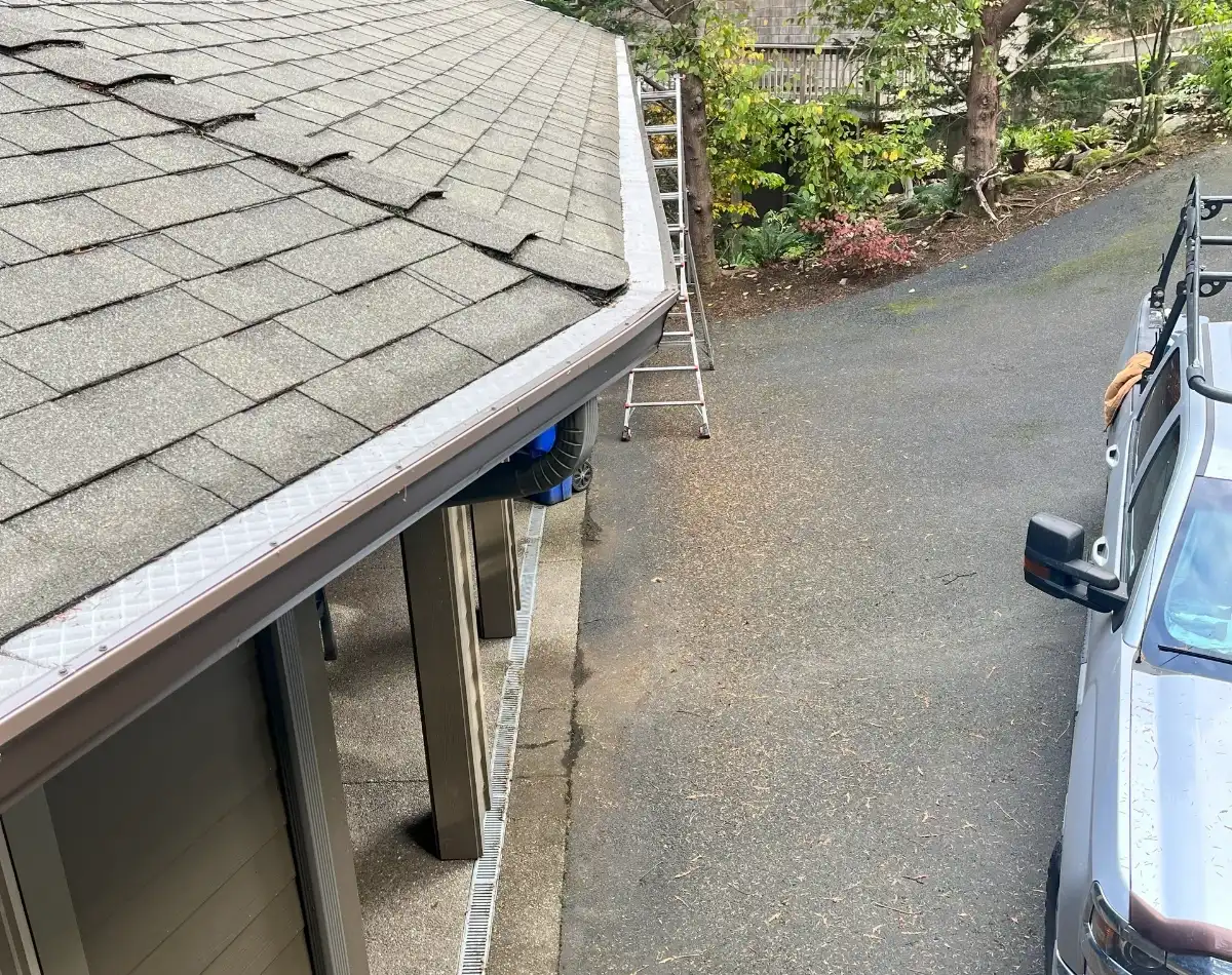 House with new gutters and a truck.